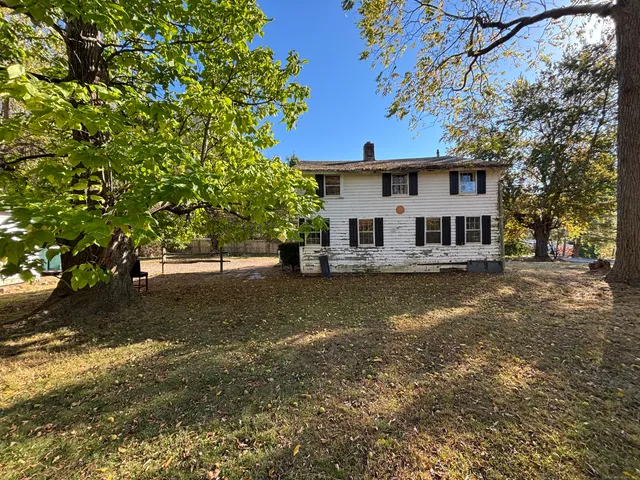 a view of a house with swimming pool