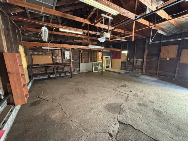 a view of a room with wooden walls