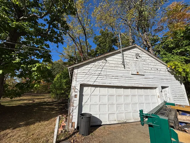 a view of house with backyard