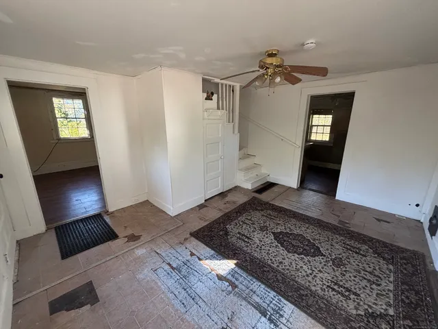a living room with furniture and a rug