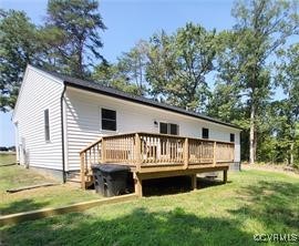215 Johnson Mill Road Bumpass, VA 23024 - Photo 3 of 9 a front view of a house with a yard table and chairs