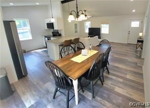 215 Johnson Mill Road Bumpass, VA 23024 - Photo 5 of 9 a view of a dining room with furniture and wooden floor