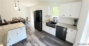 215 Johnson Mill Road Bumpass, VA 23024 - Photo 7 of 9 a kitchen with a refrigerator and a sink