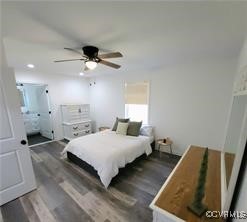 215 Johnson Mill Road Bumpass, VA 23024 - Photo 8 of 9 a spacious bedroom with a bed and a chandelier