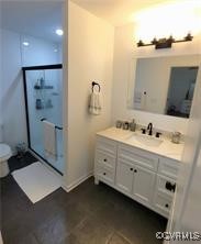 215 Johnson Mill Road Bumpass, VA 23024 - Photo 9 of 9 a spacious bathroom with a double vanity sink a large mirror and a shower