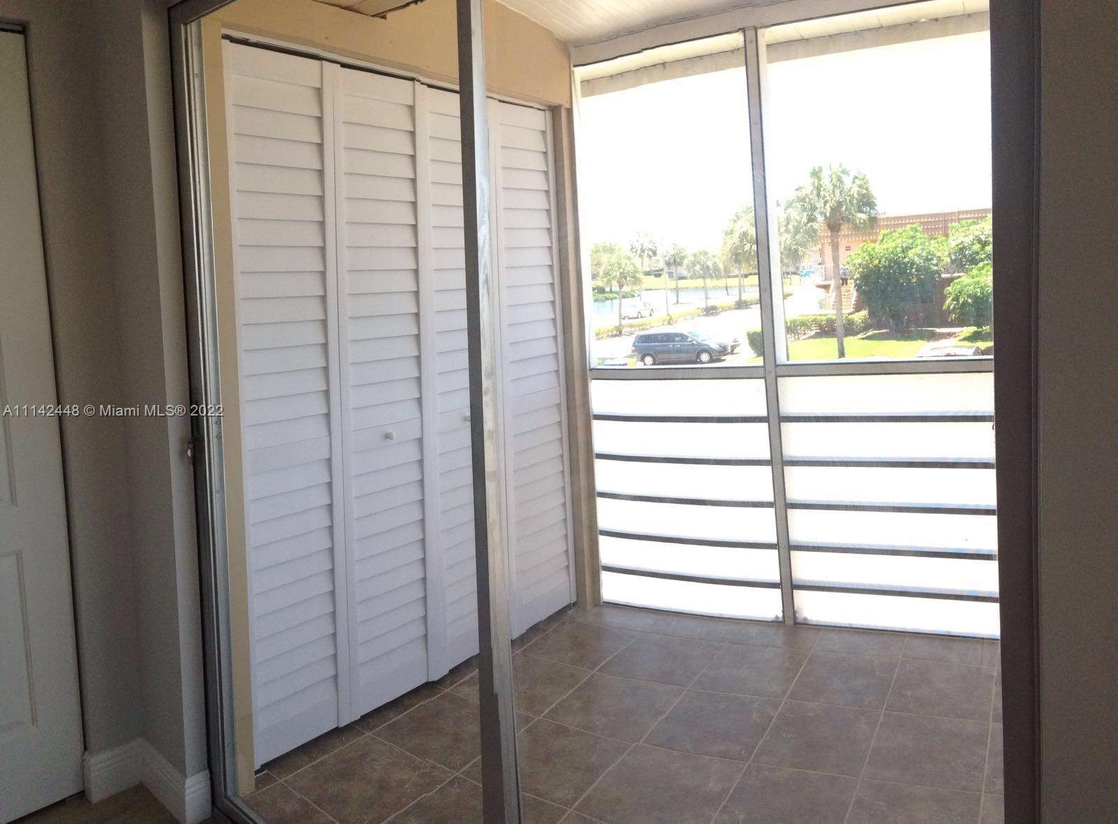 218 Brittany F, Unit E Delray Beach, FL 33446 - Photo 12 of 21 a view of a room with window