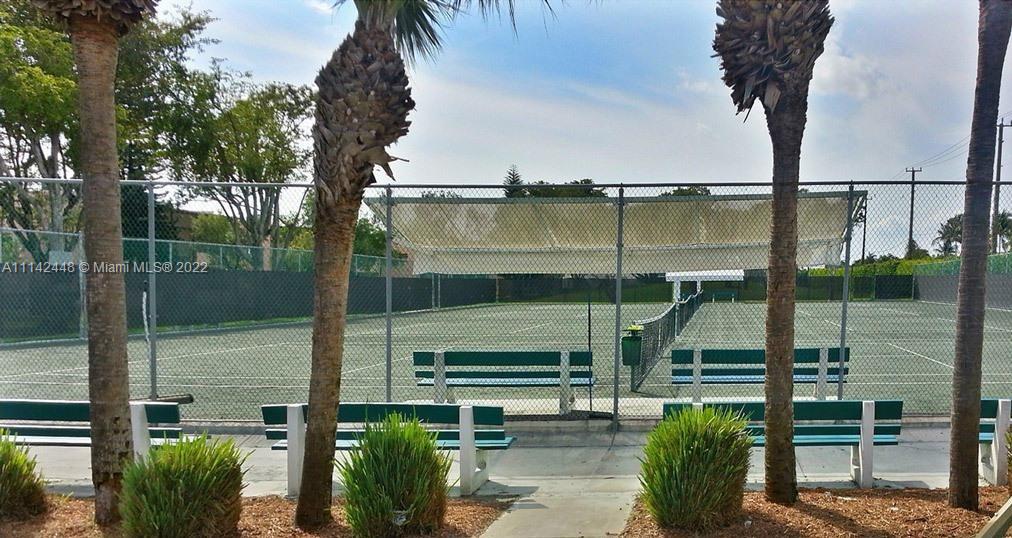 218 Brittany F, Unit E Delray Beach, FL 33446 - Photo 20 of 21 a view of a lake from a balcony