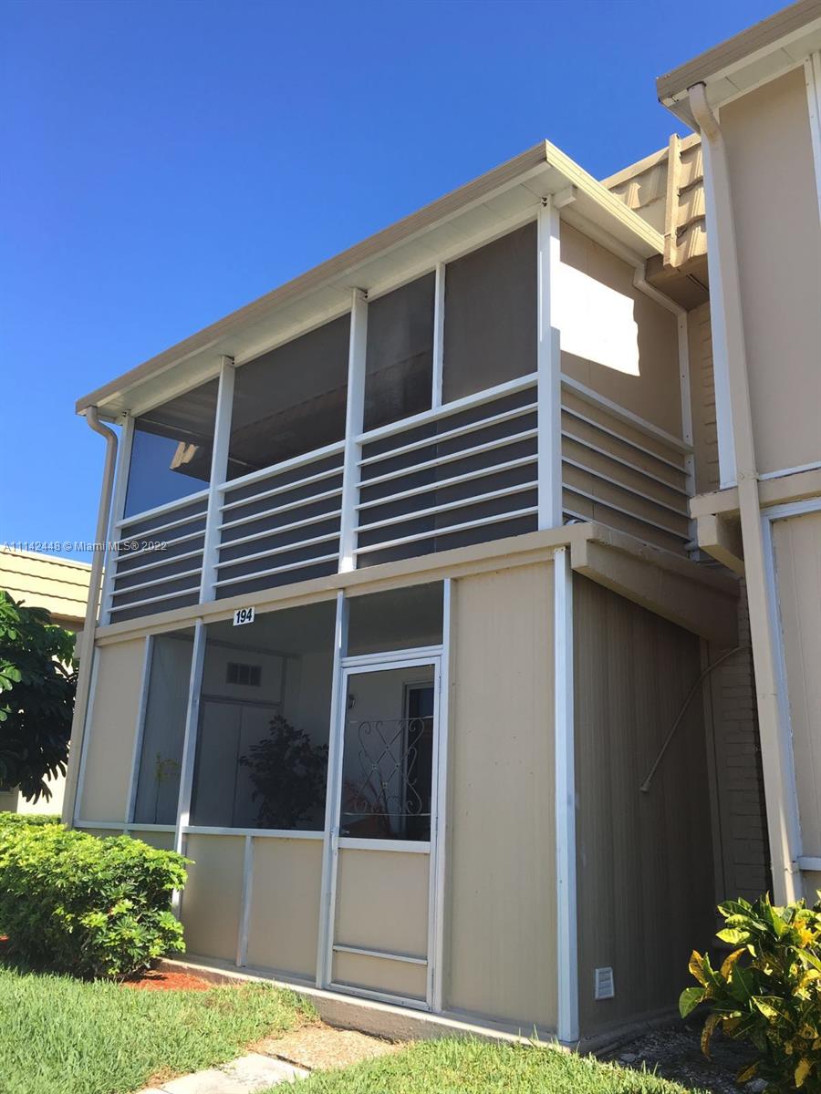 218 Brittany F, Unit E Delray Beach, FL 33446 - Photo 2 of 21 a view of a house with a window