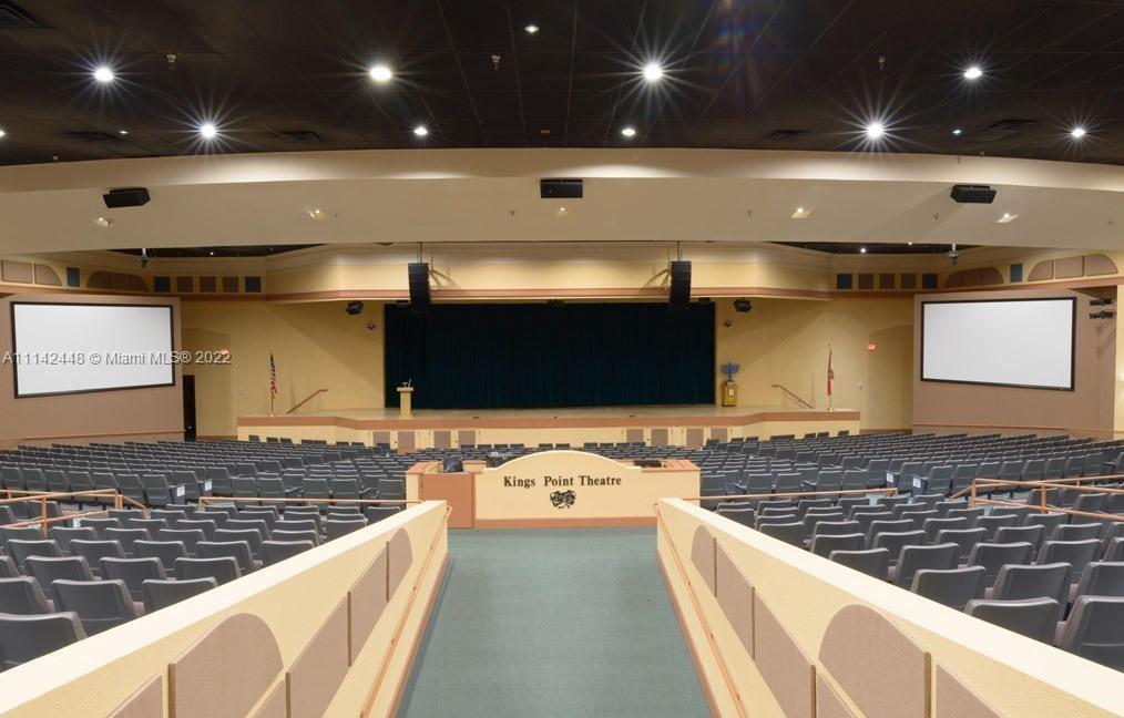 218 Brittany F, Unit E Delray Beach, FL 33446 - Photo 21 of 21 a kitchen with a sink and a stove