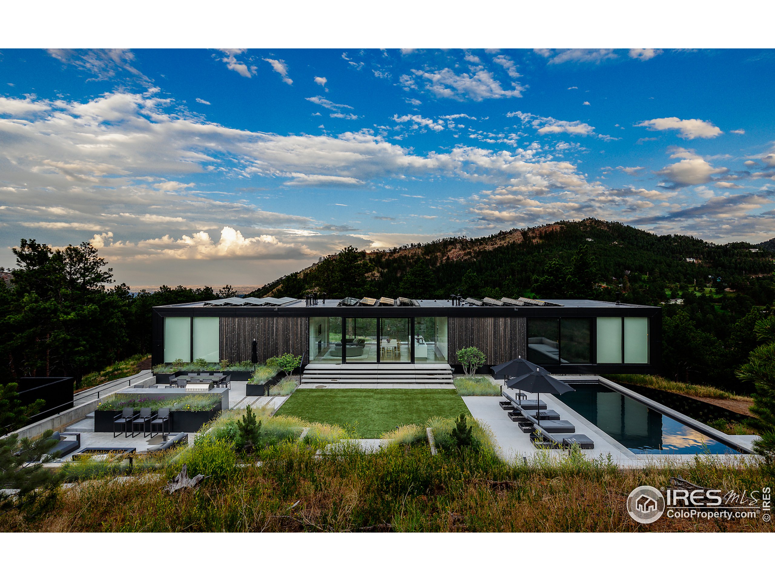 Undisclosed Address Boulder, CO 80302 - Photo 13 of 40 a swimming pool view with a lot of trees in the background
