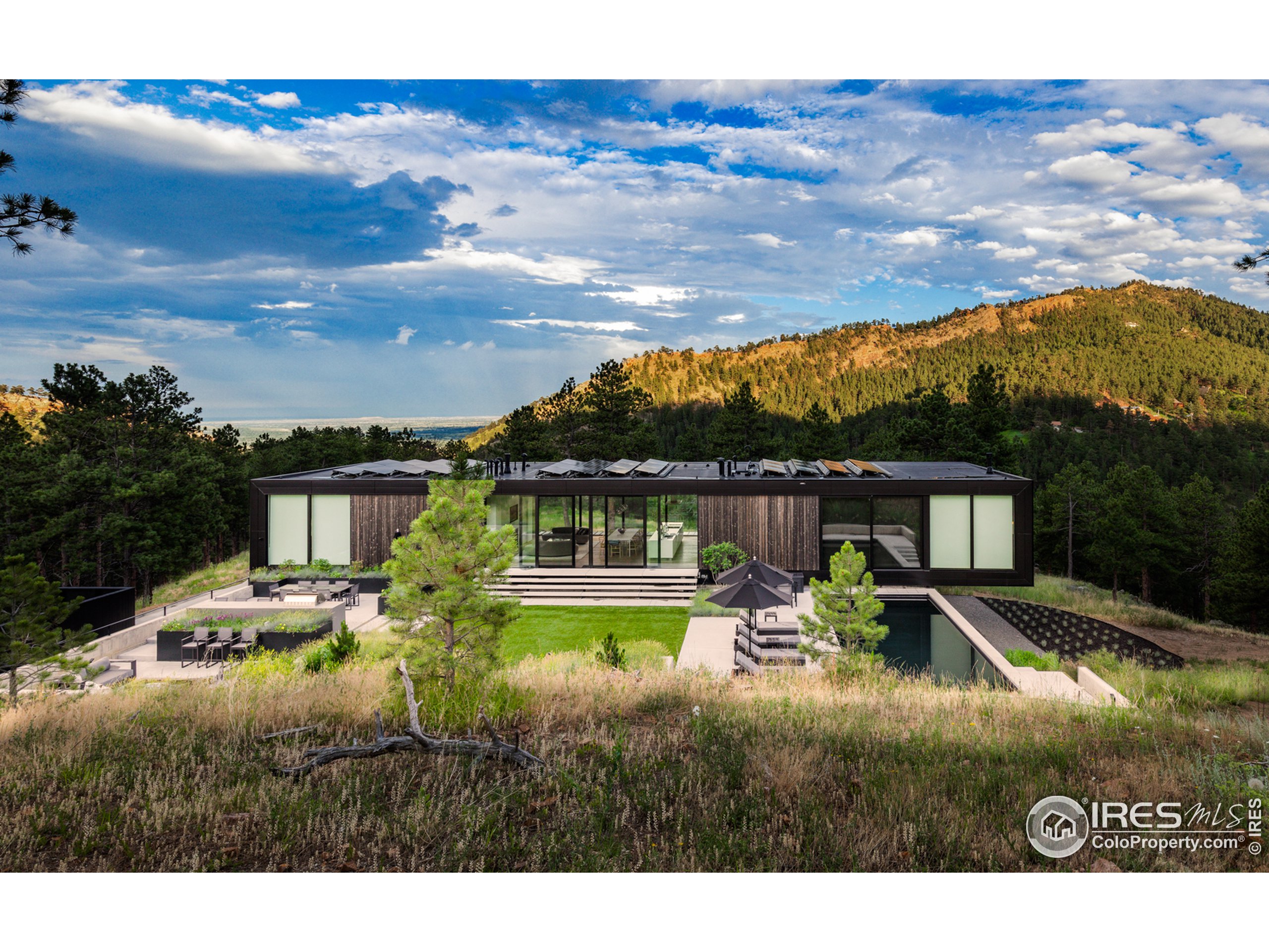 Undisclosed Address Boulder, CO 80302 - Photo 14 of 40 a view of a house with pool and a yard