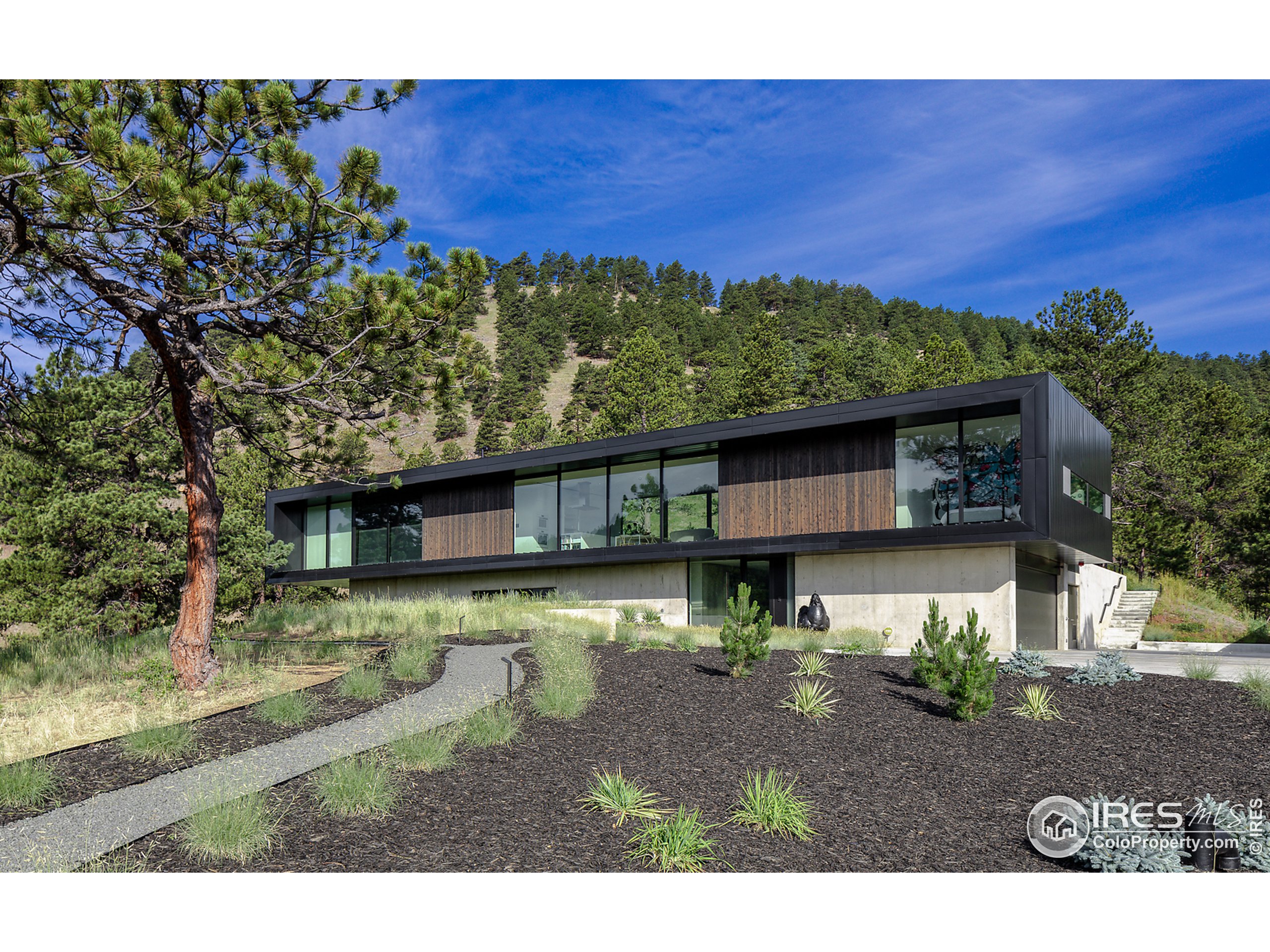 Undisclosed Address Boulder, CO 80302 - Photo 16 of 40 a view of a house with a yard