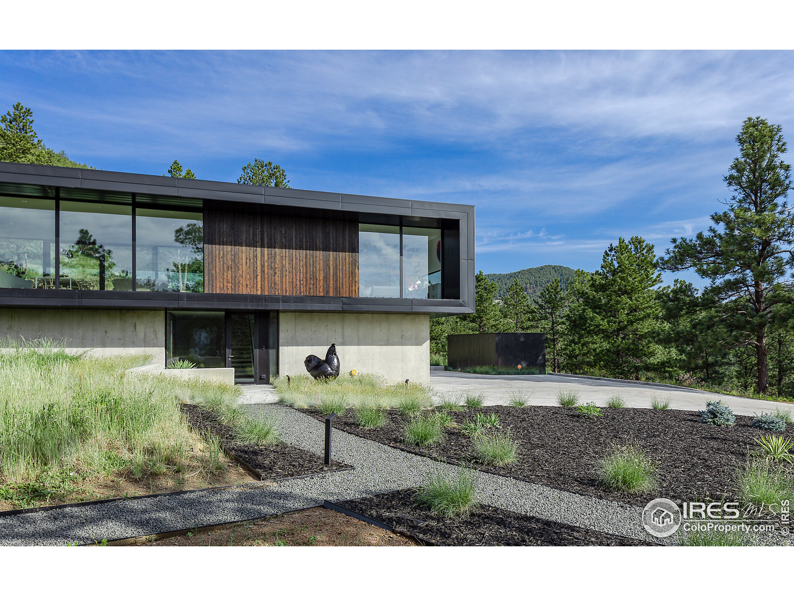 Undisclosed Address Boulder, CO 80302 - Photo 20 of 40 a view of a house with backyard and sitting area