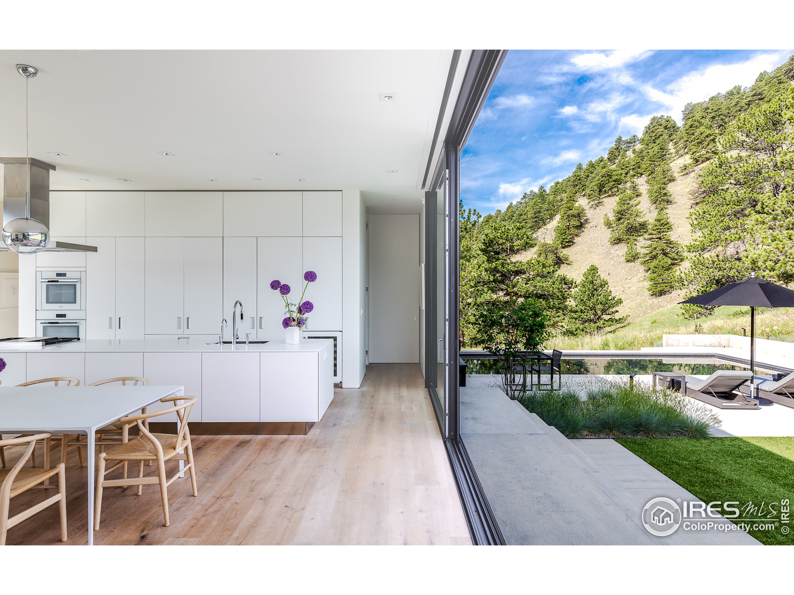 Undisclosed Address Boulder, CO 80302 - Photo 23 of 40 a living room with furniture and a wooden floor