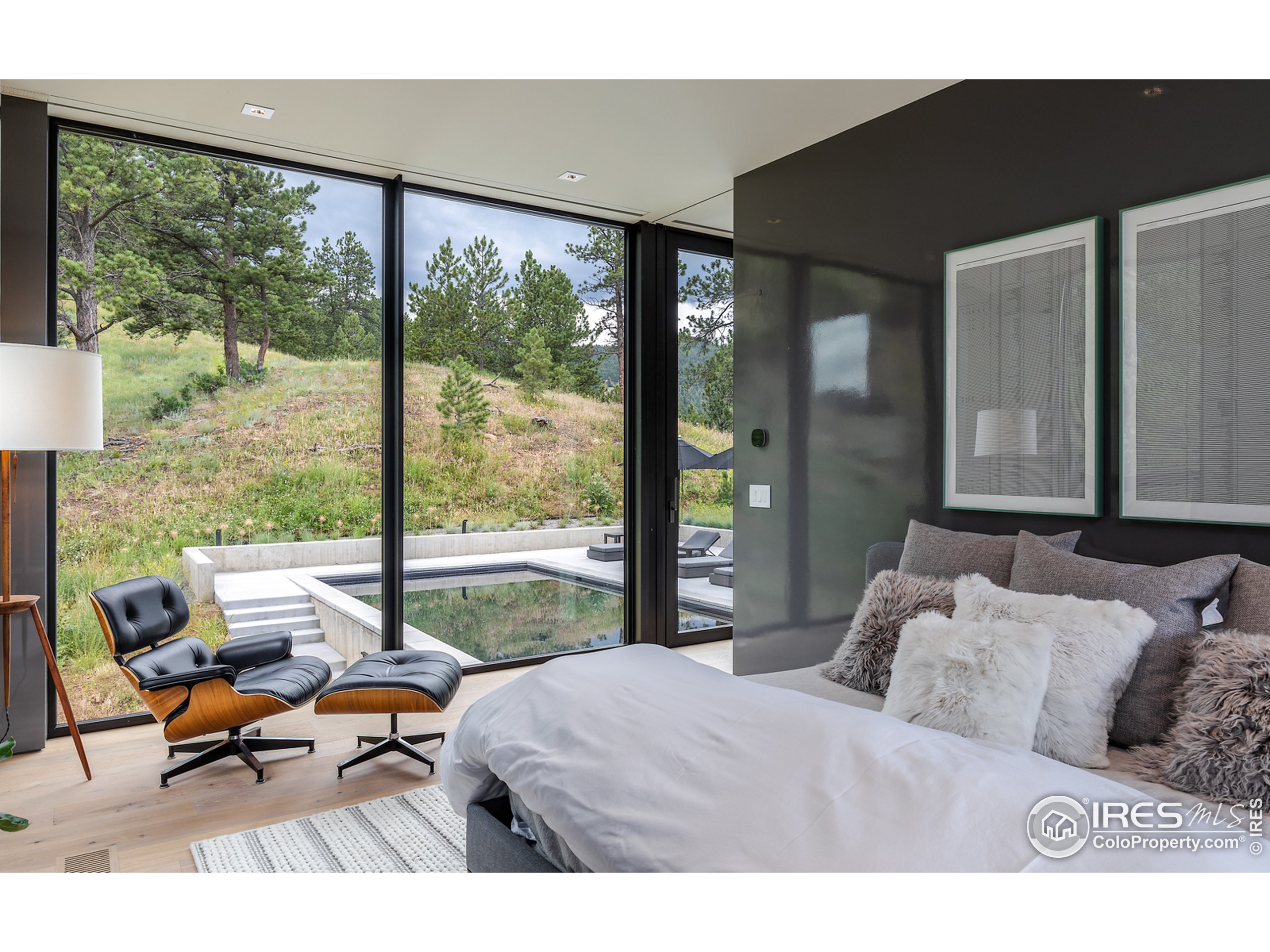 Undisclosed Address Boulder, CO 80302 - Photo 26 of 40 a bedroom with furniture and a large window