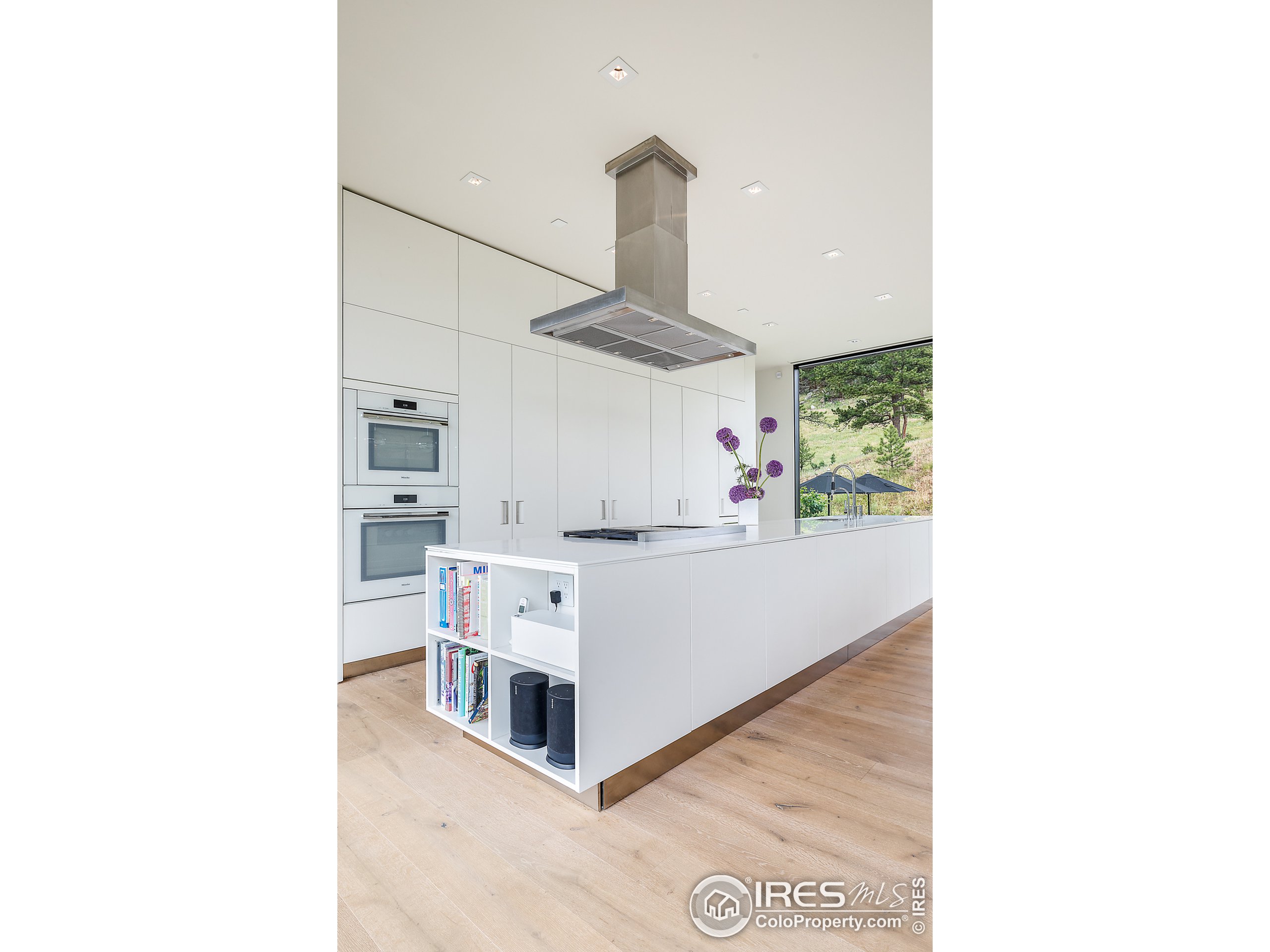 Undisclosed Address Boulder, CO 80302 - Photo 28 of 40 a living room with furniture and a chandelier
