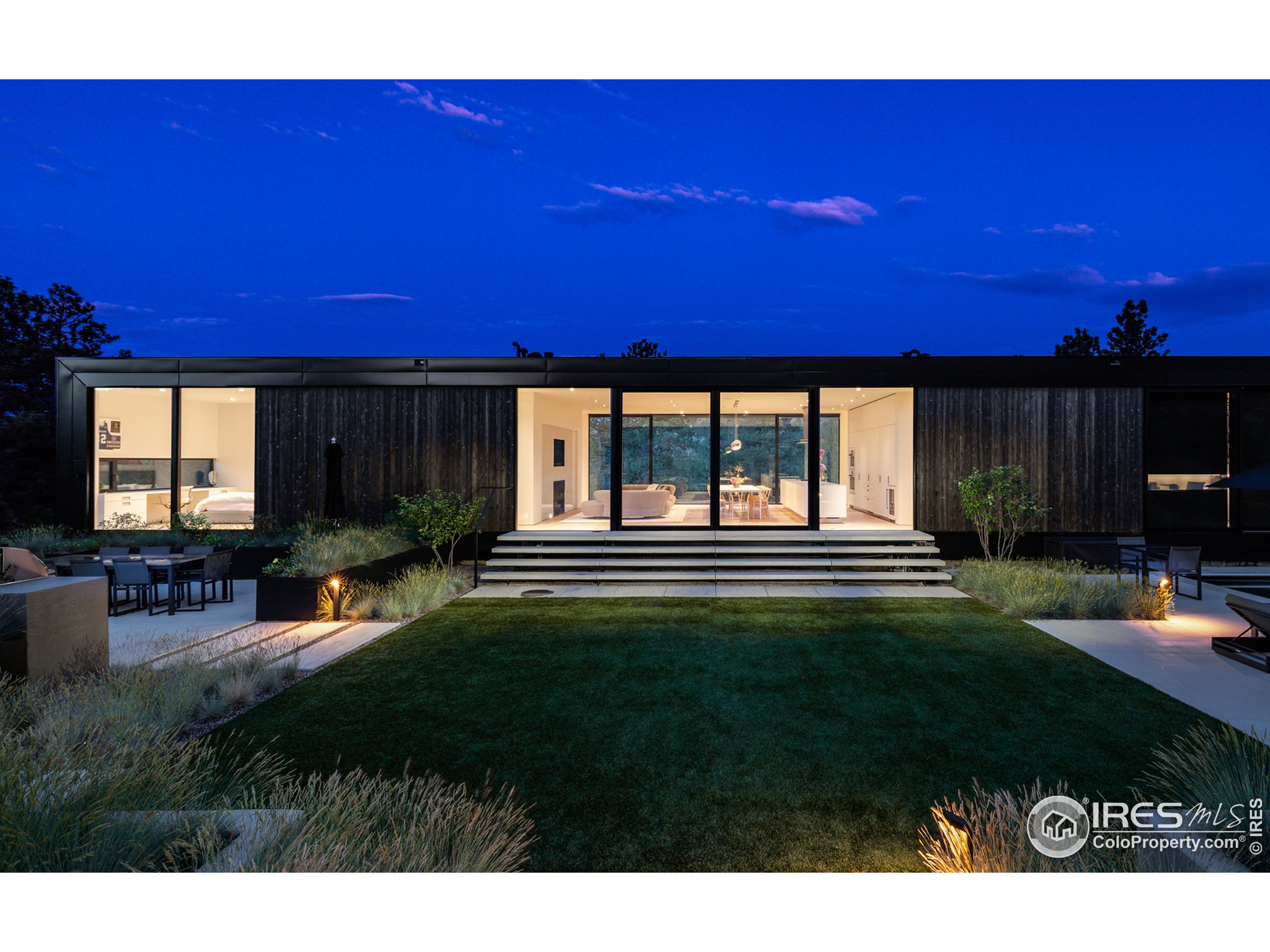 Undisclosed Address Boulder, CO 80302 - Photo 3 of 40 a view of a backyard with a table and chairs