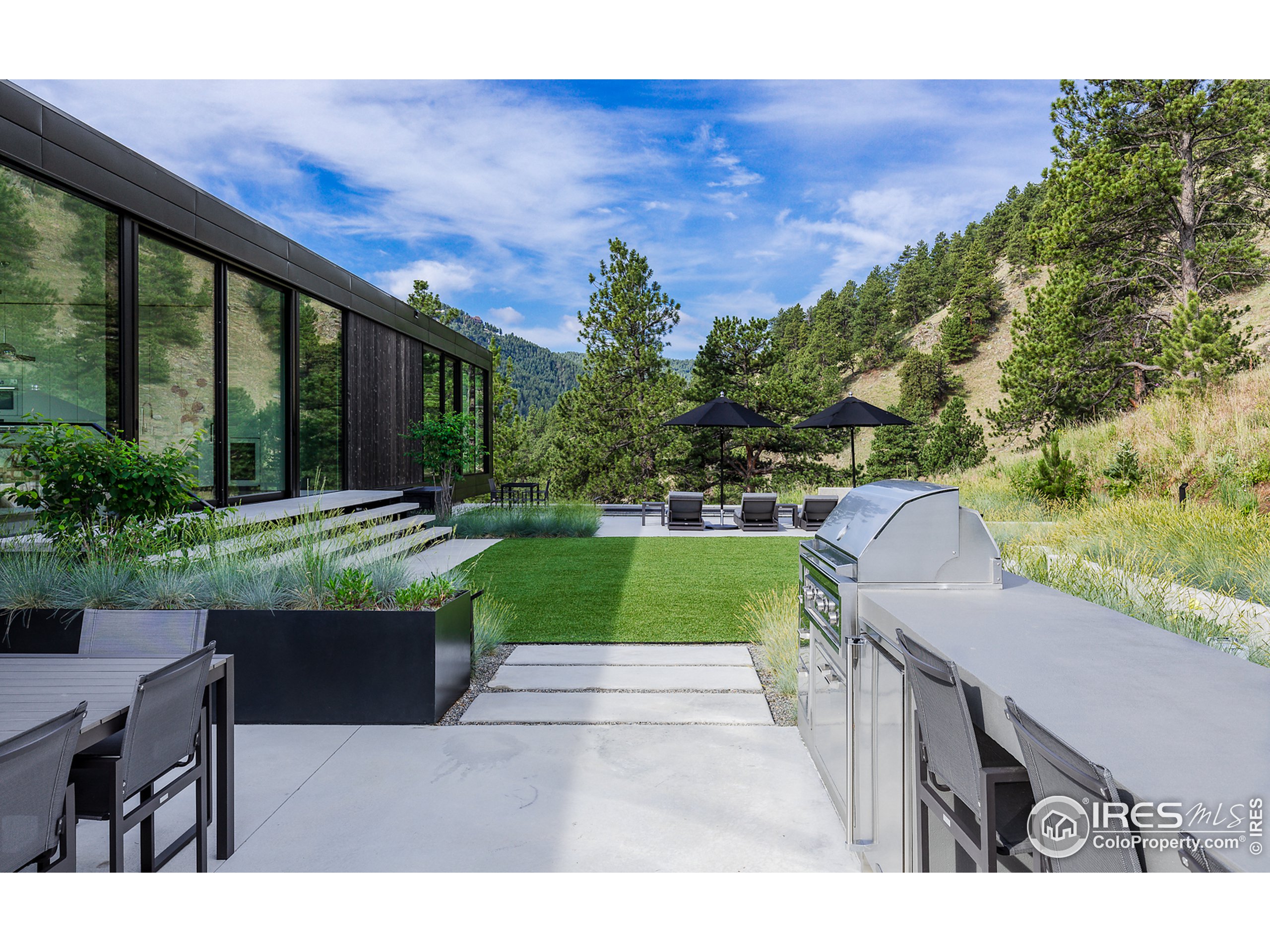Undisclosed Address Boulder, CO 80302 - Photo 5 of 40 a view of a swimming pool with a patio