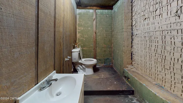 a bathroom with a sink and toilet