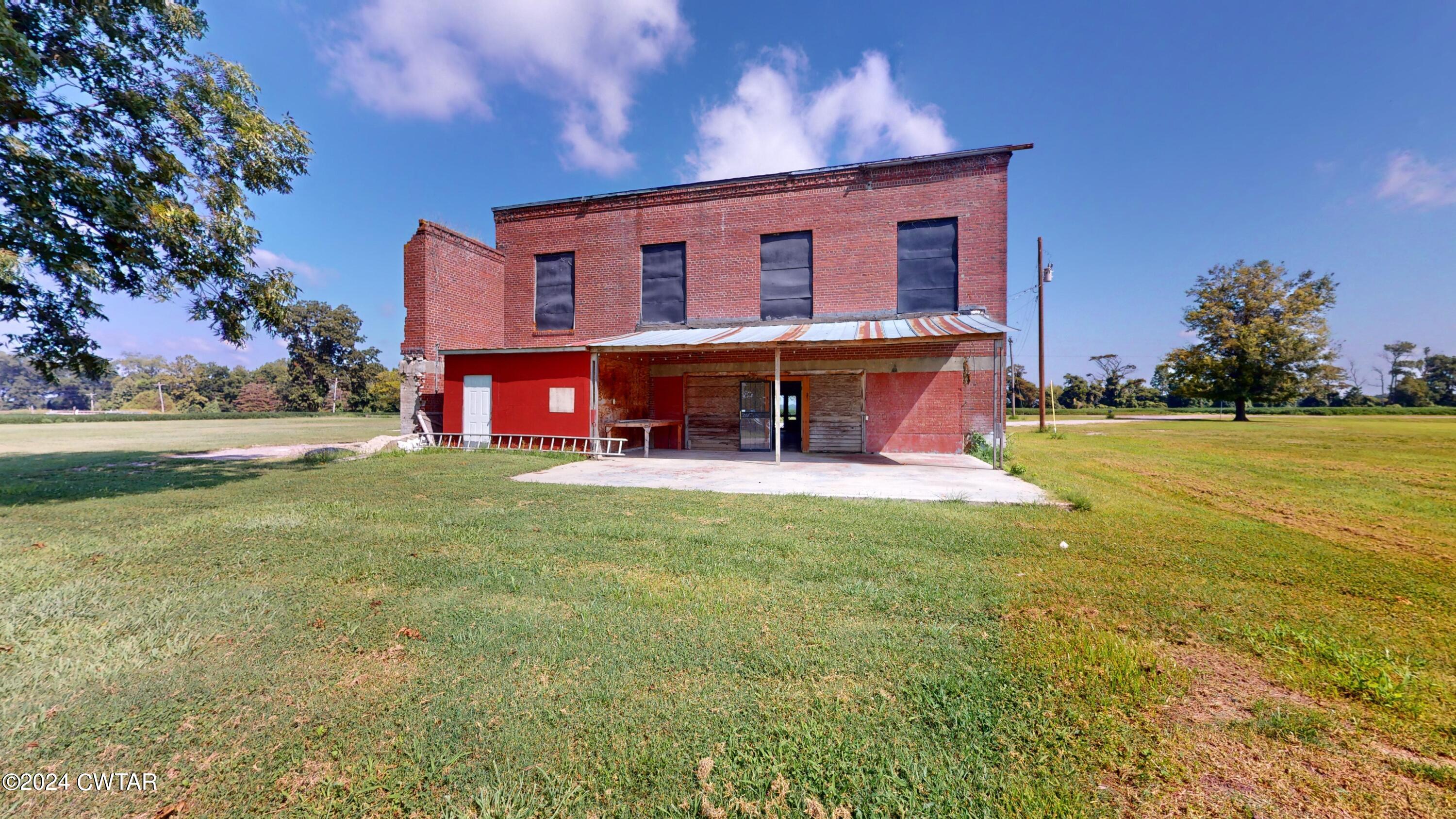 13529 Highway 19 W Ripley Tn 38063 West Ripley, TN 38063 - Photo 16 of 26 a view of a house with a yard