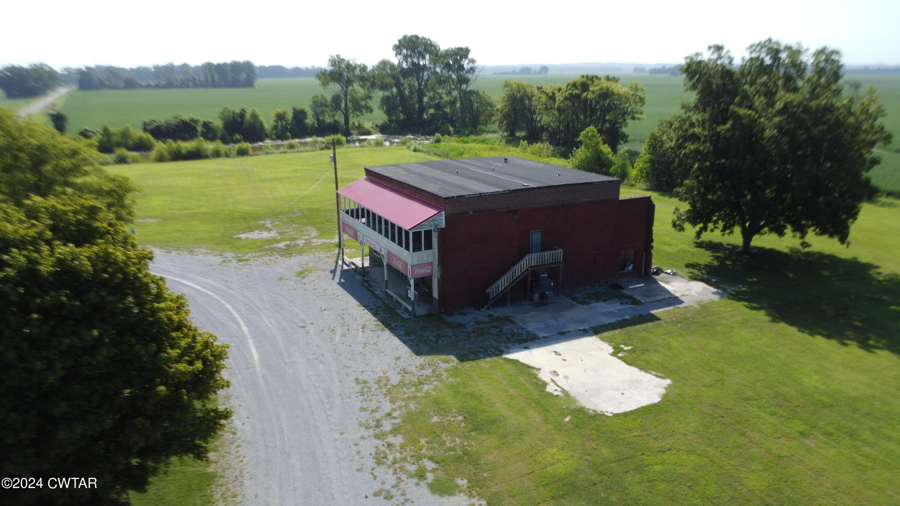 13529 Highway 19 W Ripley Tn 38063 West Ripley, TN 38063 - Photo 2 of 26 a aerial view of a house with a yard