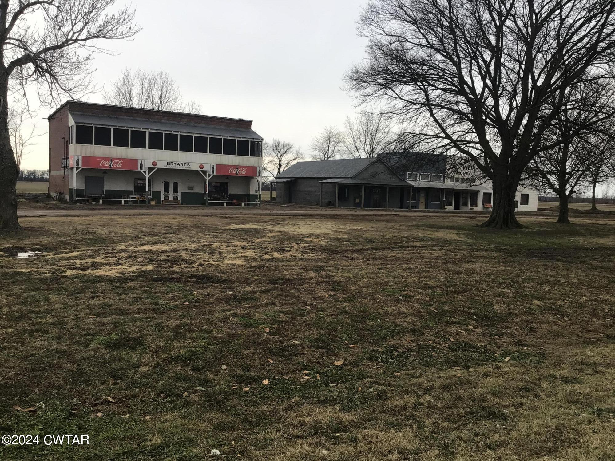 13529 Highway 19 W Ripley Tn 38063 West Ripley, TN 38063 - Photo 24 of 26 a front view of residential houses with yard and trees