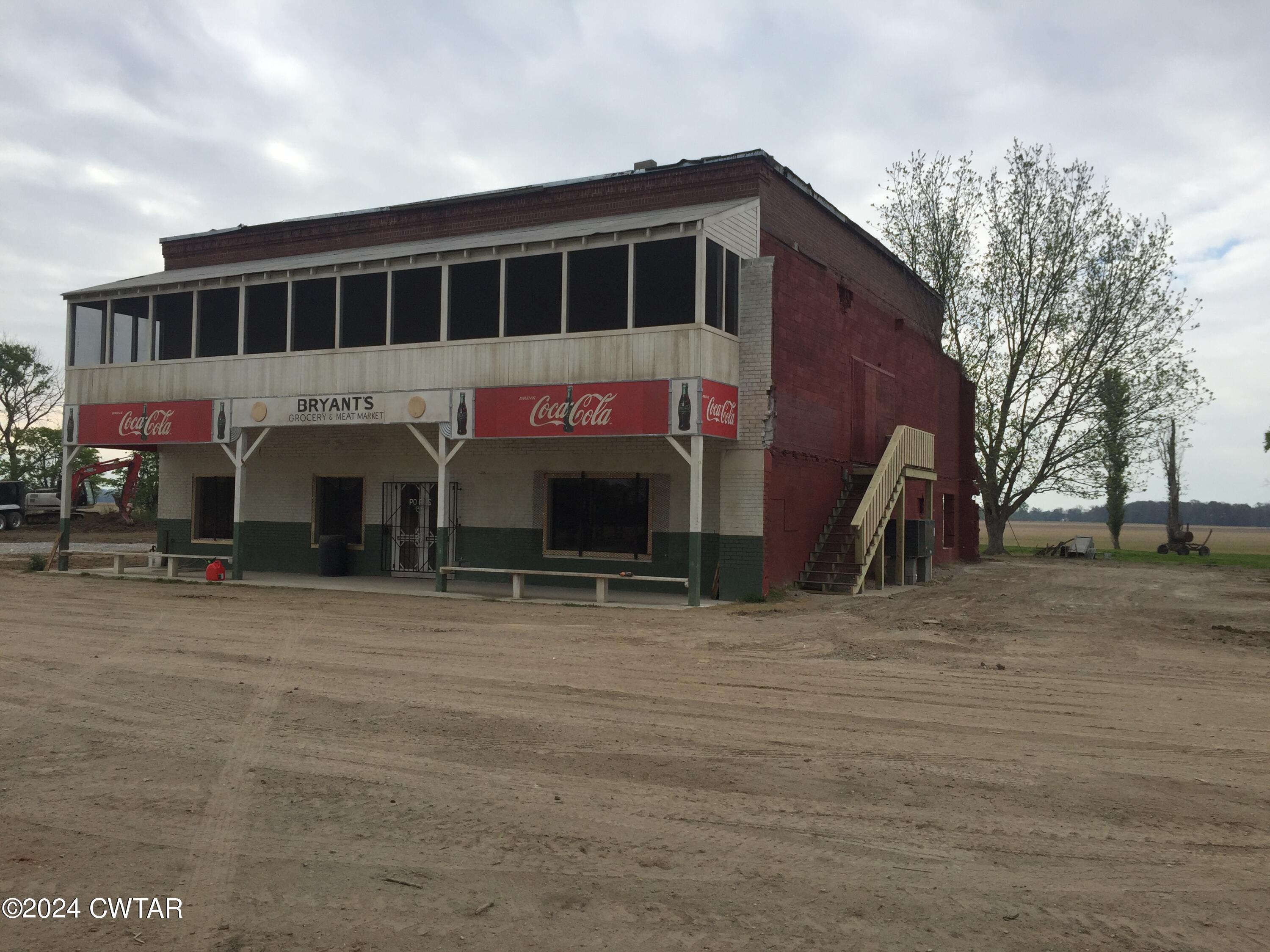 13529 Highway 19 W Ripley Tn 38063 West Ripley, TN 38063 - Photo 26 of 26 a view of a house with backyard and trees