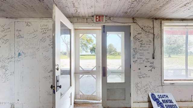 a bathroom with a glass shower door and a sink