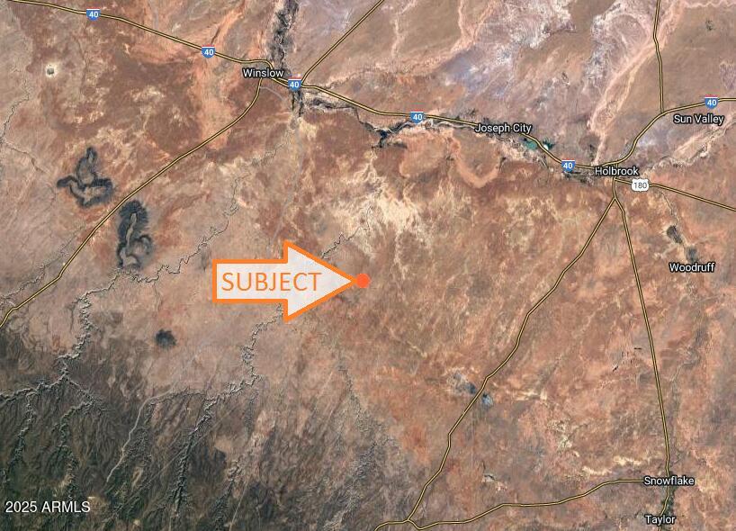 a view of a tree in front of a building