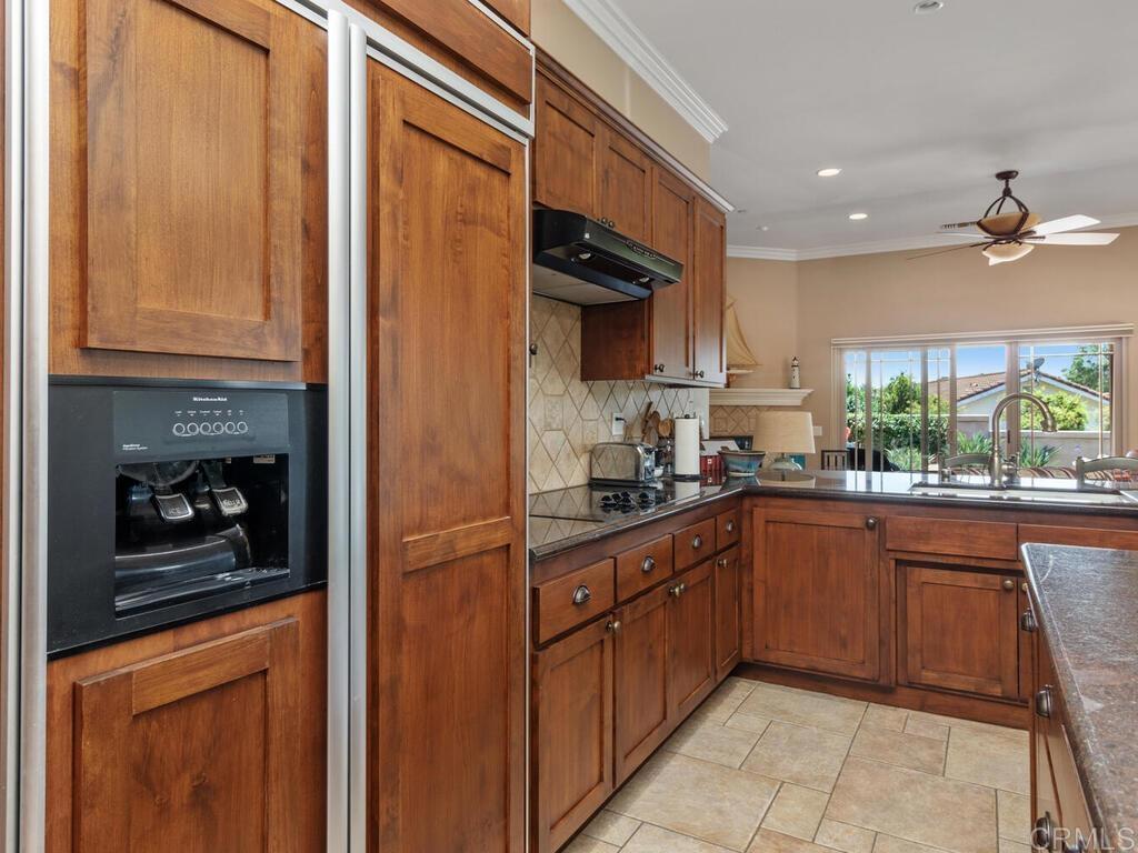 1845 Acacia Lane Fallbrook, CA 92028 - Photo 11 of 54 a kitchen with stainless steel appliances granite countertop a refrigerator and a sink
