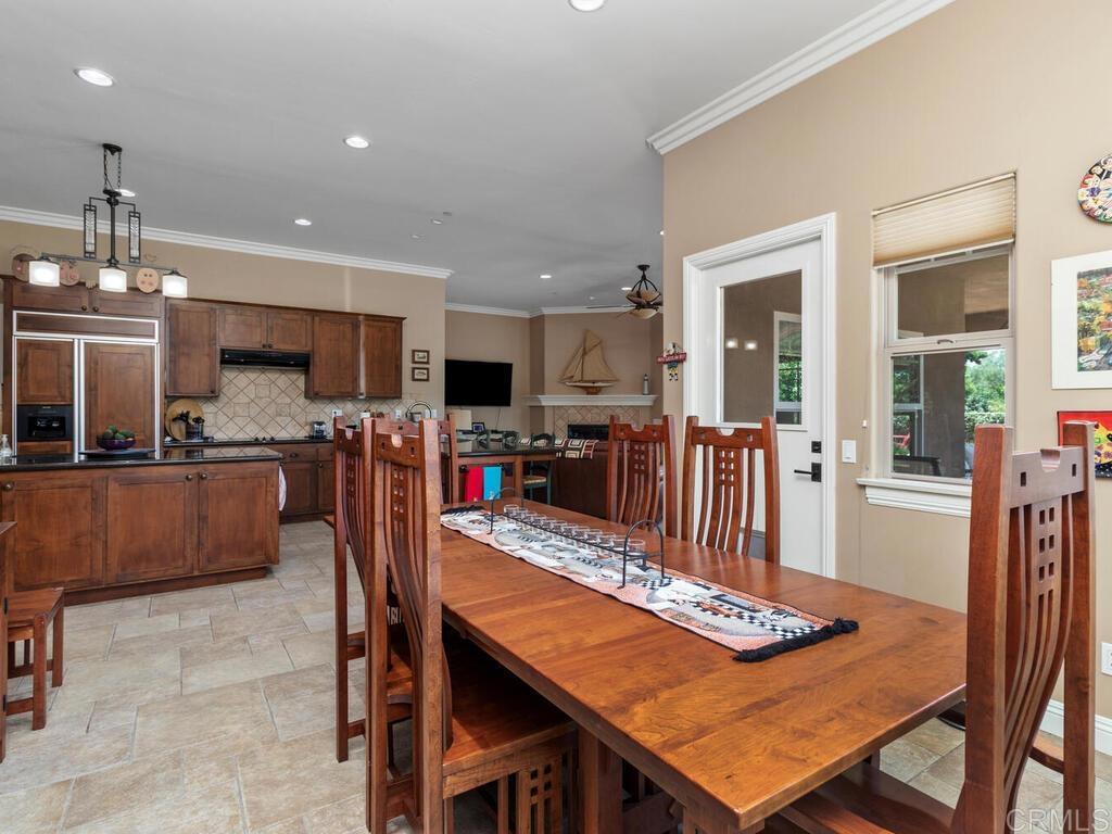 1845 Acacia Lane Fallbrook, CA 92028 - Photo 15 of 54 a dining room with furniture and a kitchen view