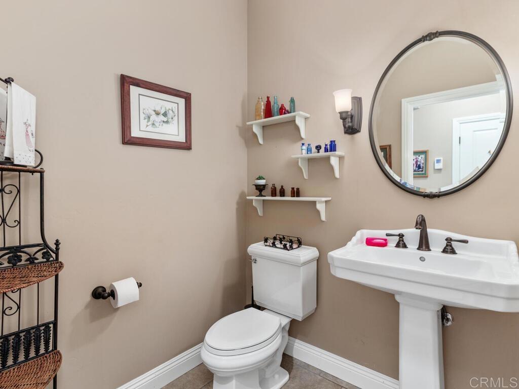 1845 Acacia Lane Fallbrook, CA 92028 - Photo 21 of 54 a bathroom with a sink mirror and toilet