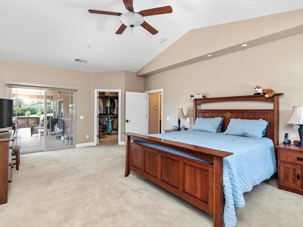 1845 Acacia Lane Fallbrook, CA 92028 - Photo 28 of 54 a bedroom with a bed and large cabinets