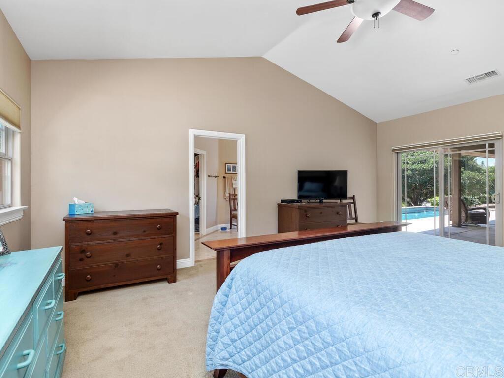 1845 Acacia Lane Fallbrook, CA 92028 - Photo 29 of 54 a bedroom with a bed and a flat screen tv