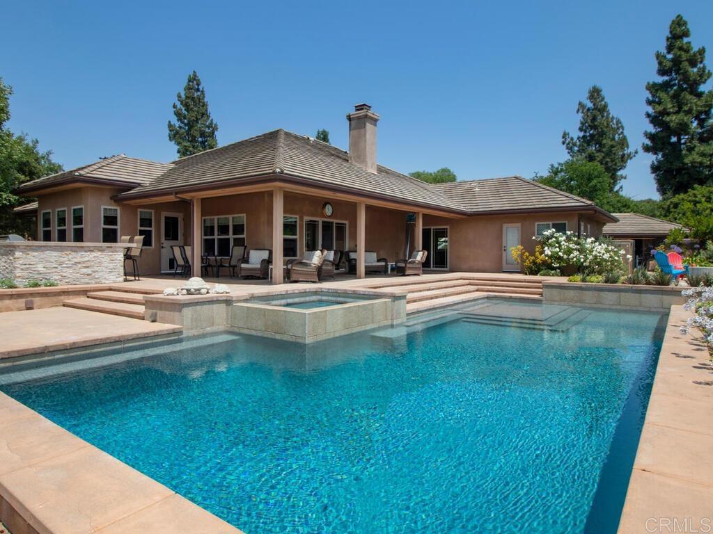 1845 Acacia Lane Fallbrook, CA 92028 - Photo 34 of 54 a front view of a house with swimming pool having outdoor seating