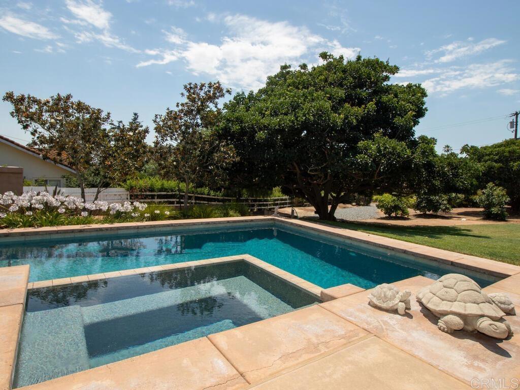 1845 Acacia Lane Fallbrook, CA 92028 - Photo 36 of 54 a view of swimming pool with outdoor seating and trees in the background