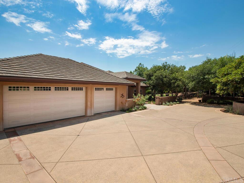 1845 Acacia Lane Fallbrook, CA 92028 - Photo 54 of 54 a front view of a house with a yard and garage