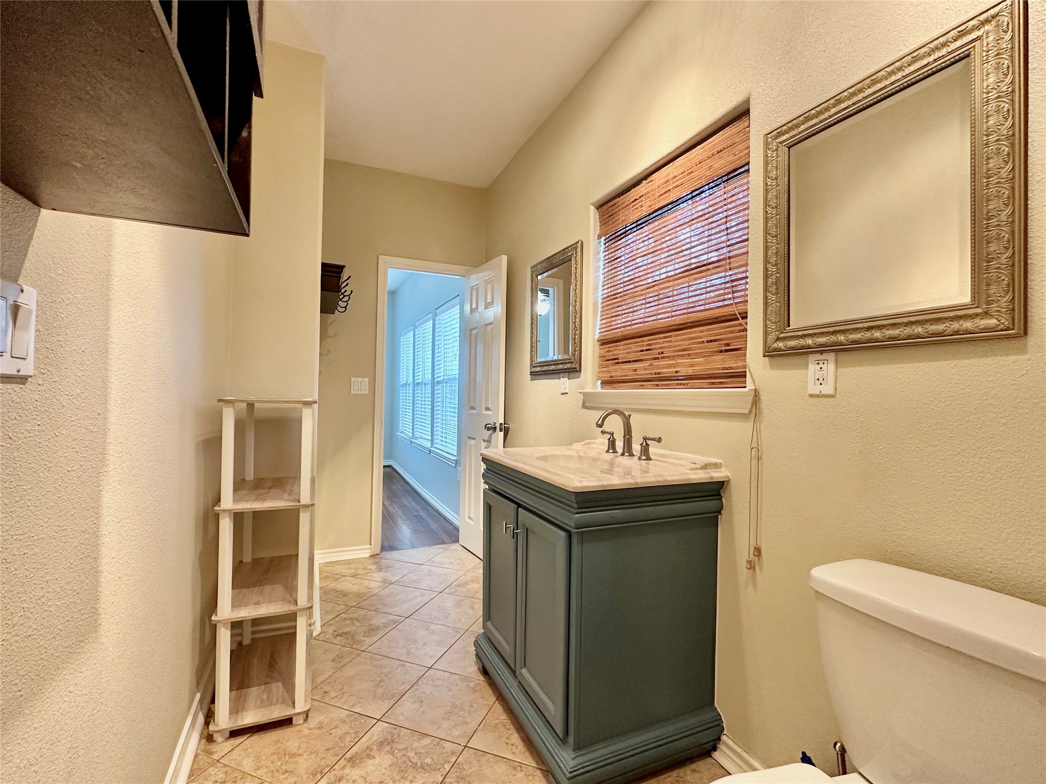 112 Munford Street Houston, TX 77008 - Photo 16 of 28 a bathroom with a sink a toilet and a mirror