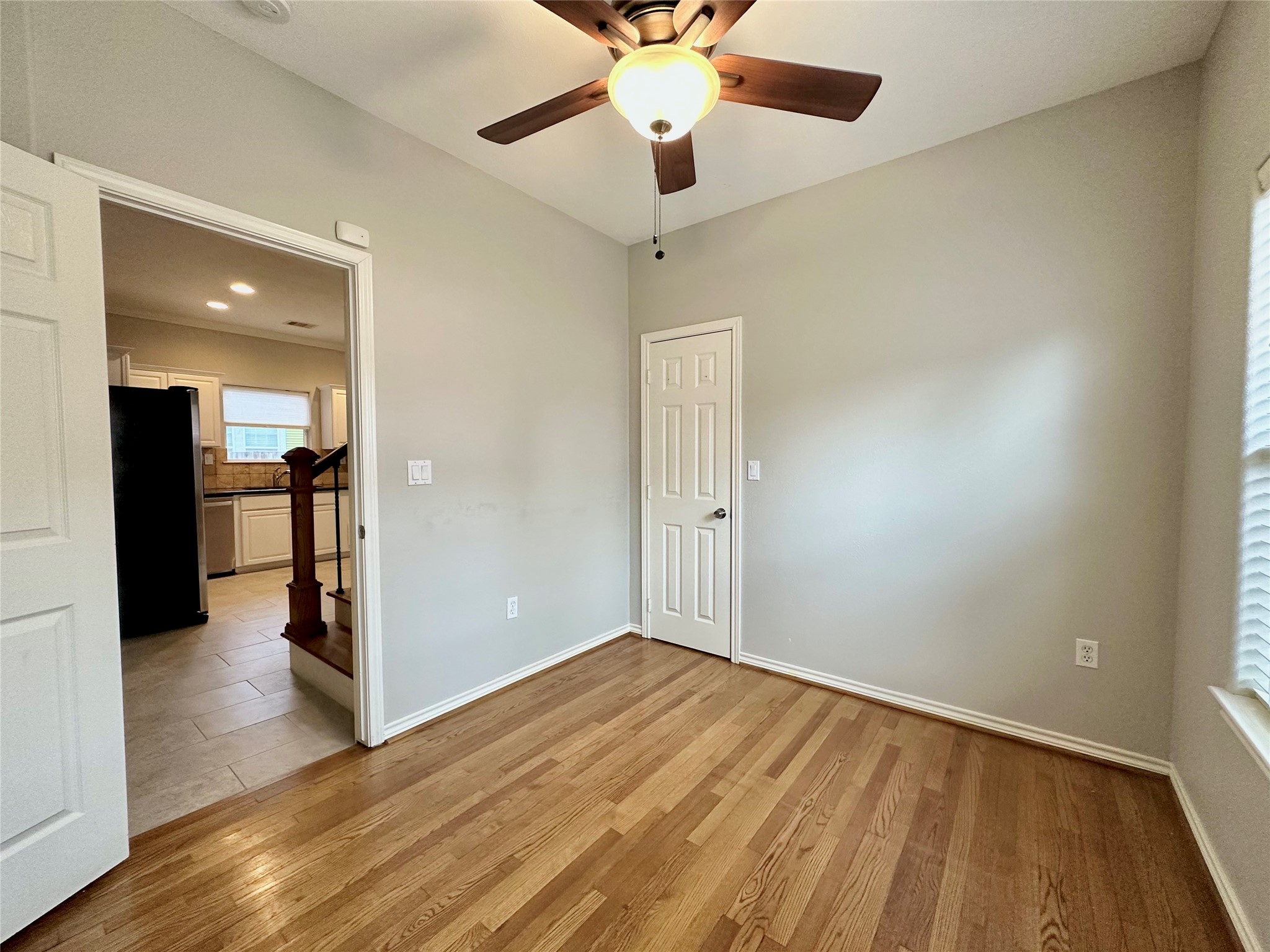 112 Munford Street Houston, TX 77008 - Photo 19 of 28 wooden floor in an empty room with a window