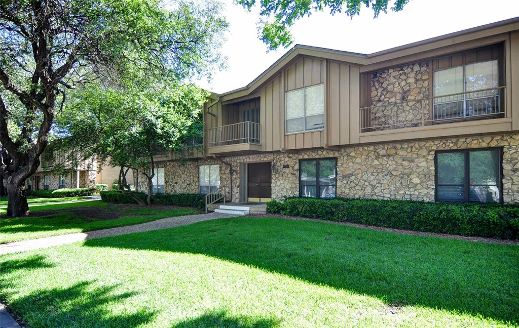 11400 Park Central Place, Unit C Dallas, TX 75230 - Photo 16 of 20 a front view of a house with a yard