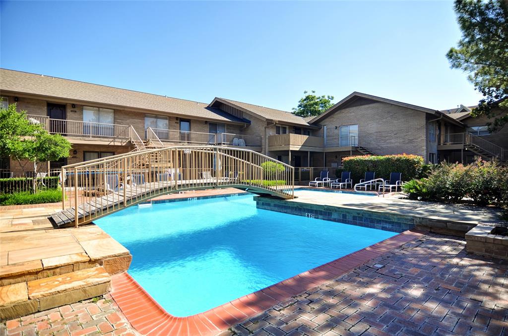 11400 Park Central Place, Unit C Dallas, TX 75230 - Photo 18 of 20 a view of a house with swimming pool