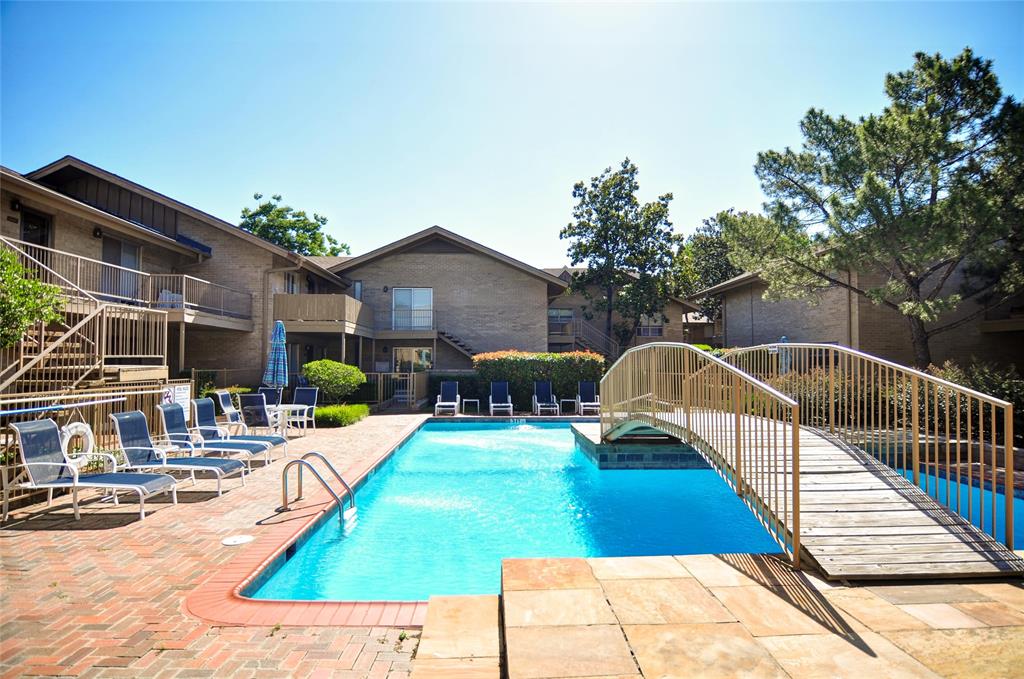11400 Park Central Place, Unit C Dallas, TX 75230 - Photo 19 of 20 a view of a house with swimming pool and sitting area