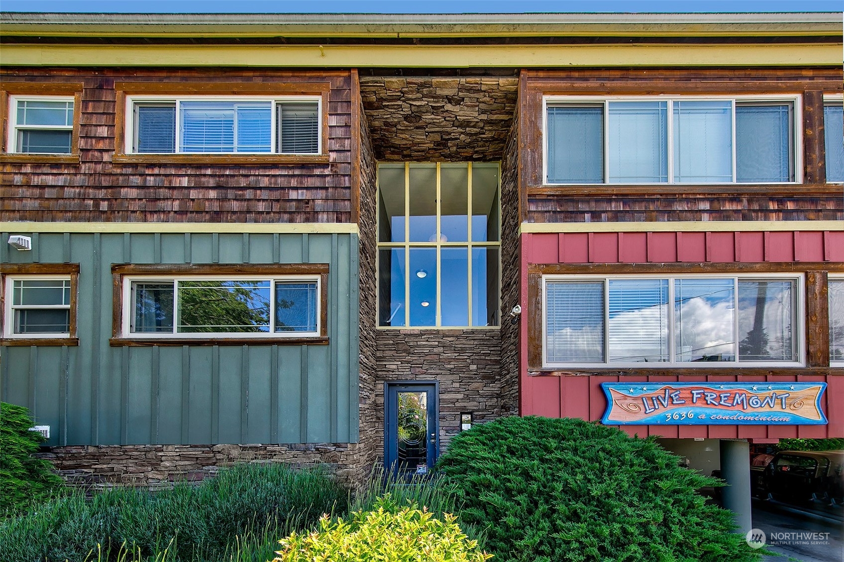 3636 Evanston Avenue North, Unit 4 Seattle, WA 98103 - Photo 19 of 19 a front view of a house with a yard