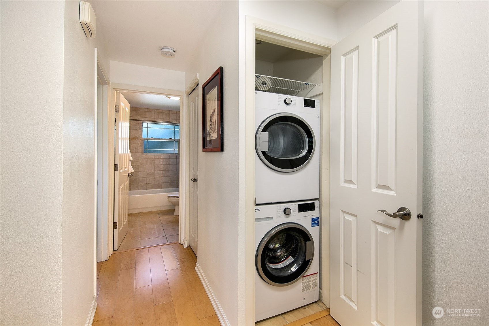 3636 Evanston Avenue North, Unit 4 Seattle, WA 98103 - Photo 9 of 19 a view of a hallway with washer and dryer