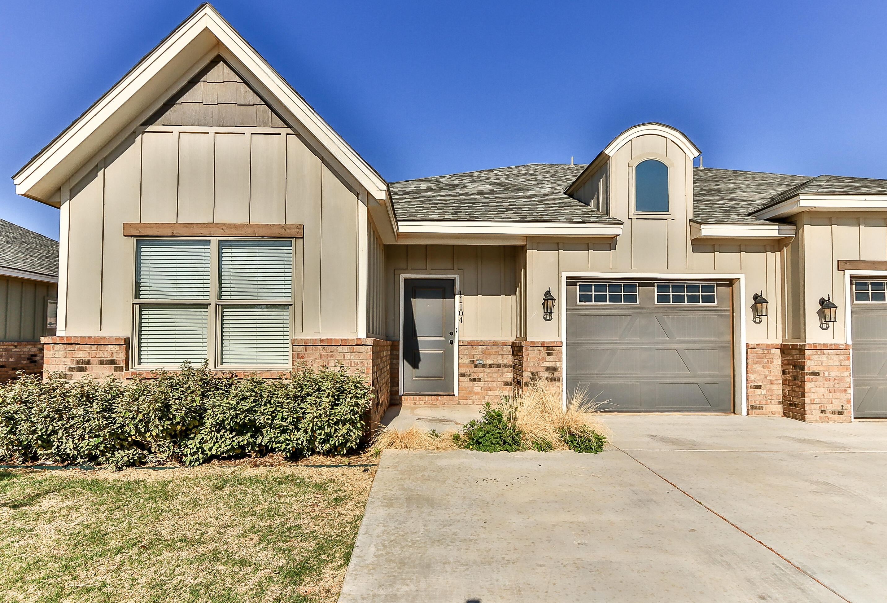2510 112th Street, Unit B Lubbock, TX 79423 - Photo 13 of 28 a front view of a house with a yard