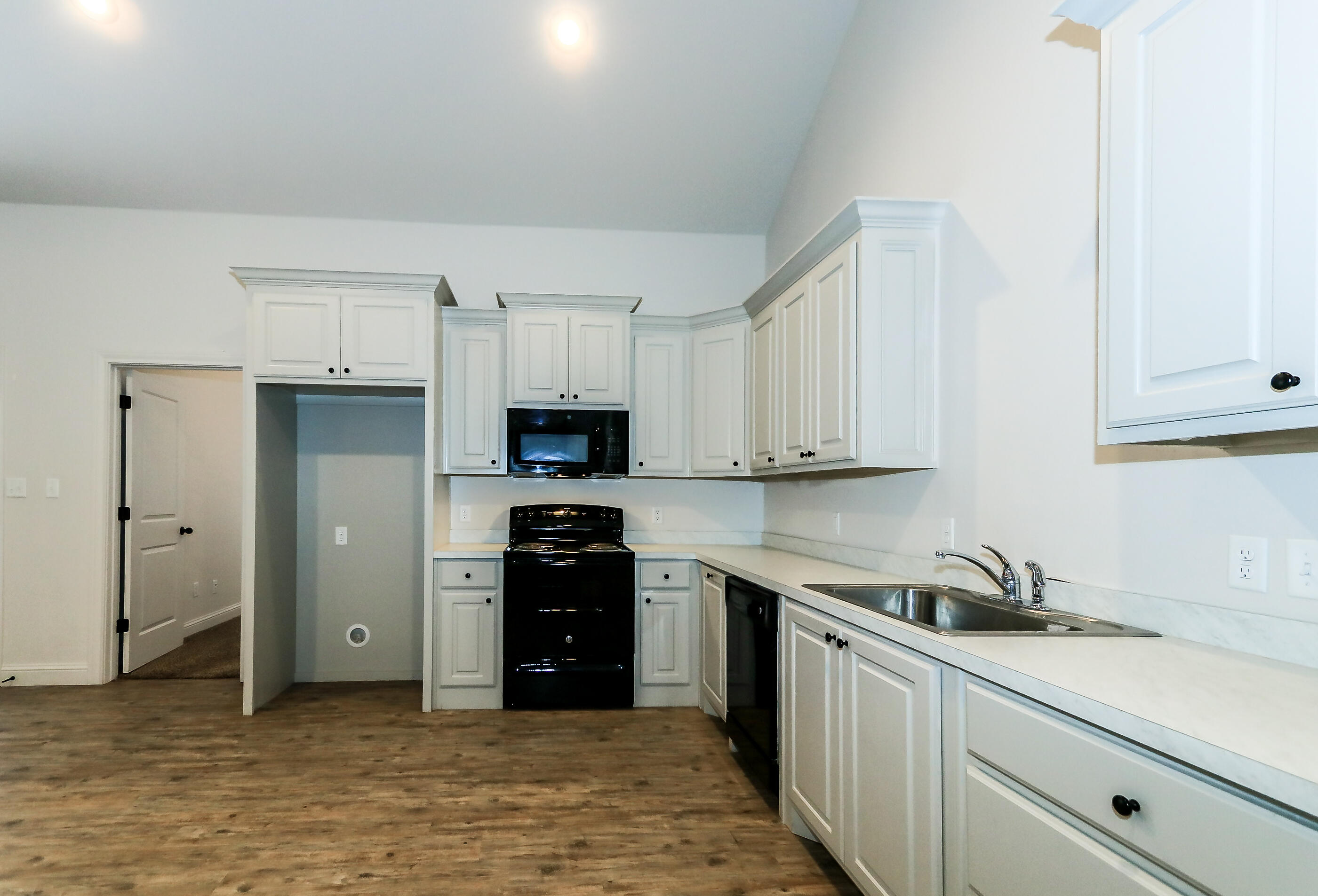 2510 112th Street, Unit B Lubbock, TX 79423 - Photo 19 of 28 a kitchen with stainless steel appliances granite countertop a refrigerator and a sink