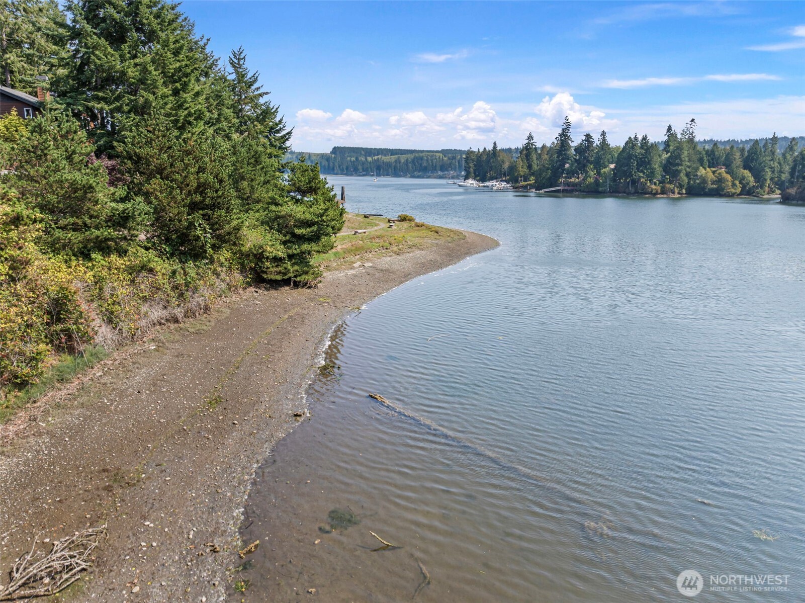 150 Ebb Tide Court Port Ludlow, WA 98365 - Photo 12 of 15 a view of a lake with houses in the background