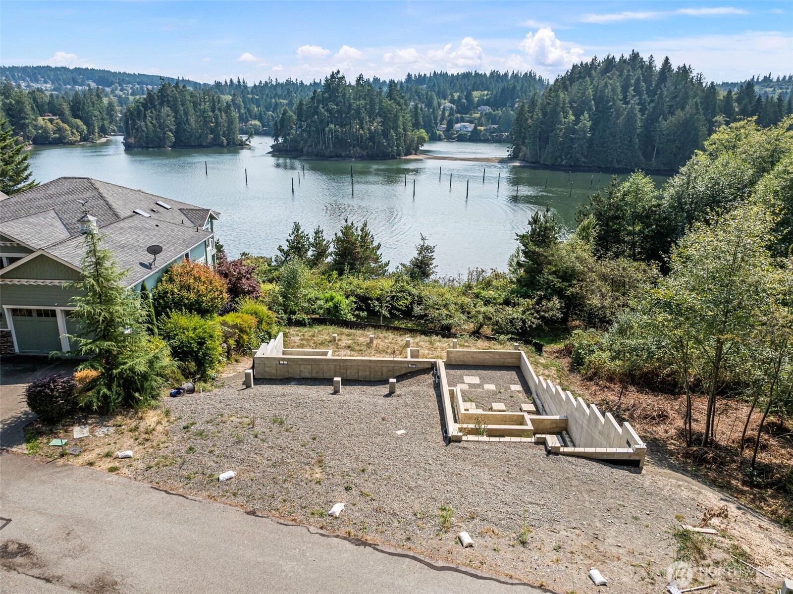 150 Ebb Tide Court Port Ludlow, WA 98365 - Photo 9 of 15 a view of a lake with a mountain in the background