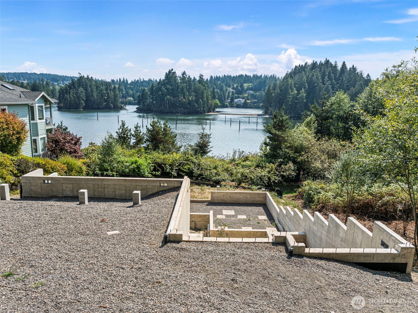 150 Ebb Tide Court Port Ludlow, WA 98365 - Photo 10 of 15 a view of a garden with a bench in front of the house
