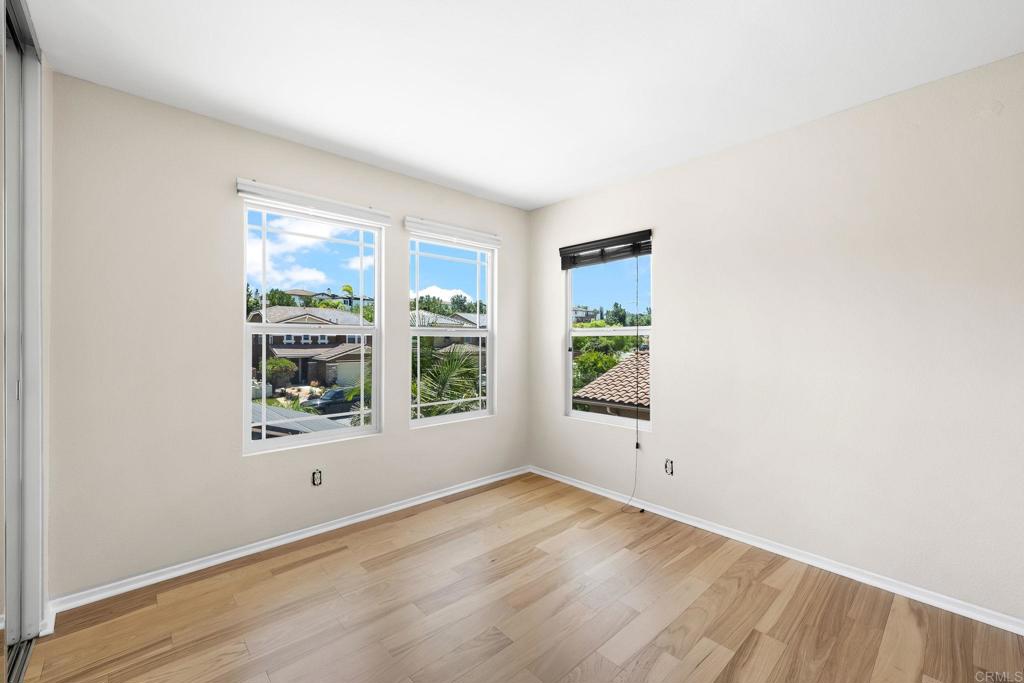1412 Long View Drive Chula Vista, CA 91915 - Photo 26 of 45 an empty room with wooden floor and windows
